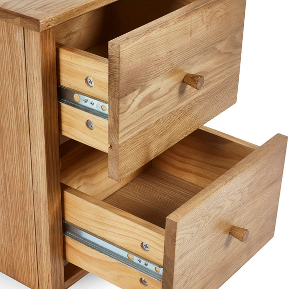 Wooden drawer unit with open drawers on a white background