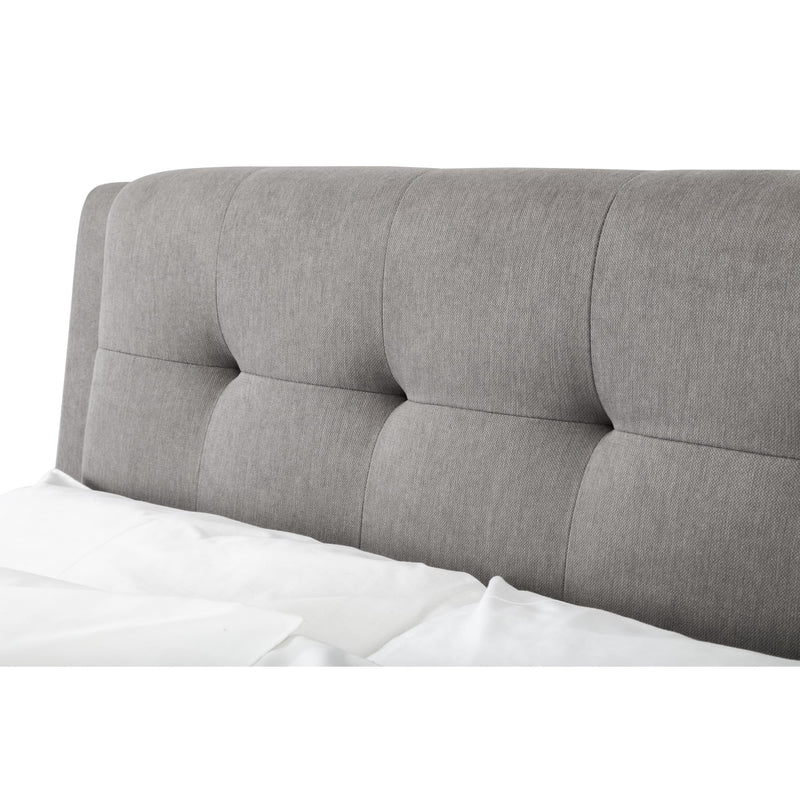 Gray upholstered headboard on a white background