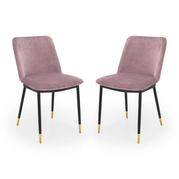 Two purple velvet chairs with black legs on a white background