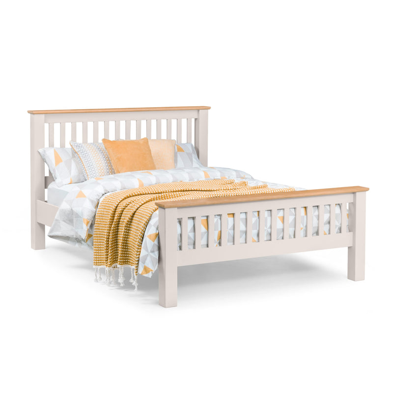 White bed frame with yellow bedding on a white background