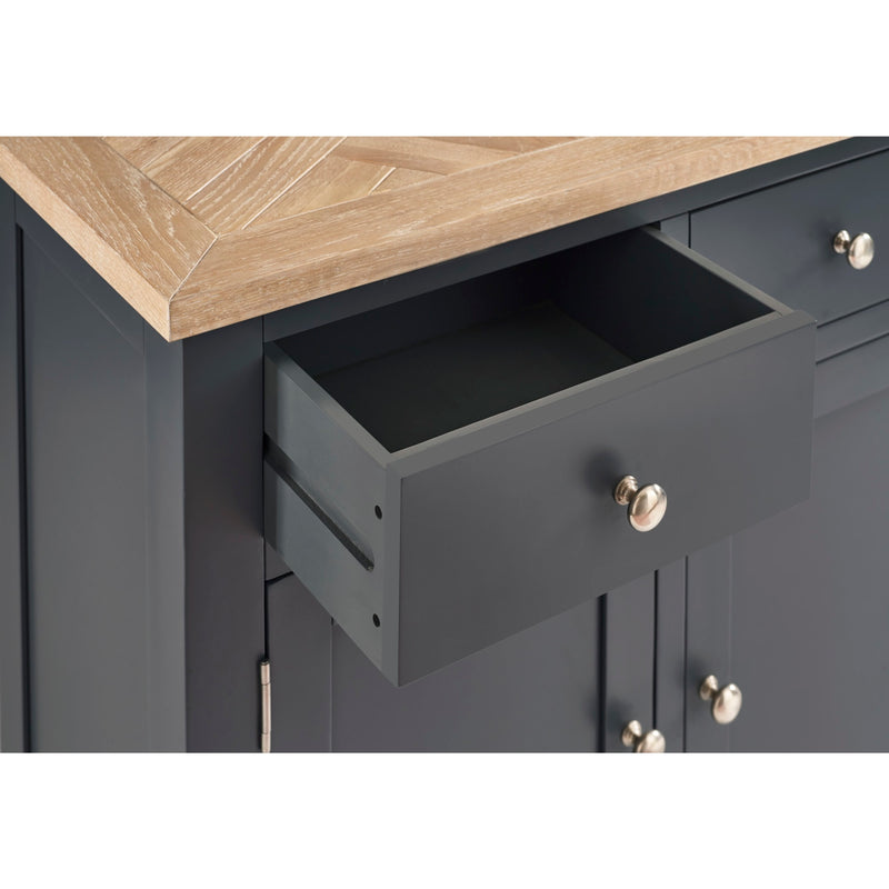 Gray cabinet with open drawer and wooden countertop