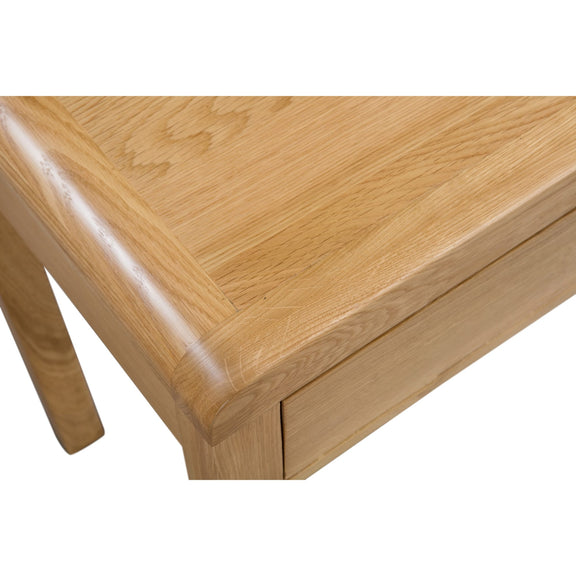 Close-up of a wooden table corner on a white background