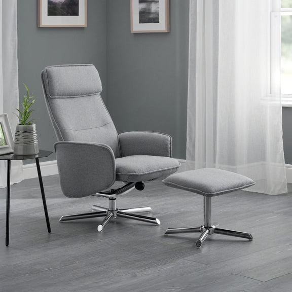 Gray recliner chair with ottoman in a room with gray walls and white curtains.
