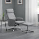 Gray recliner chair with ottoman in a room with gray walls and white curtains.