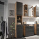 Modern bathroom interior with wooden and gray cabinets, sink, and decorative elements.