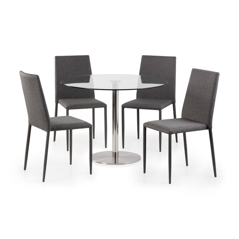 Round glass dining table with four gray chairs on a white background