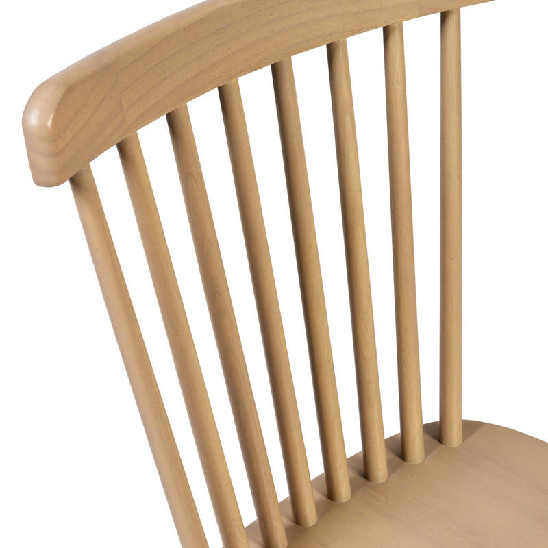 Close-up of a wooden chair with slatted backrest on a white background