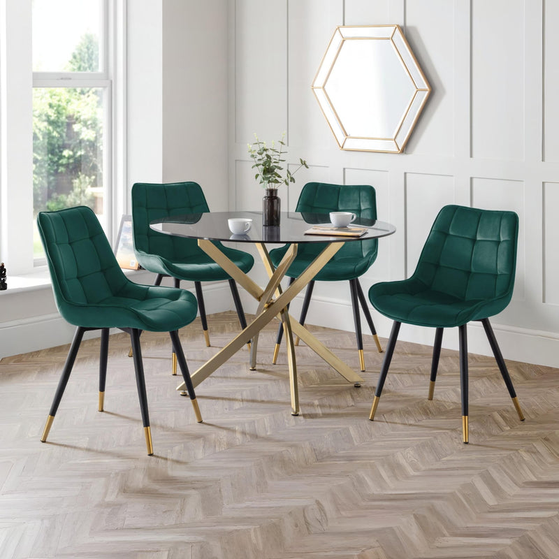 Dining room with green chairs and a gold table.