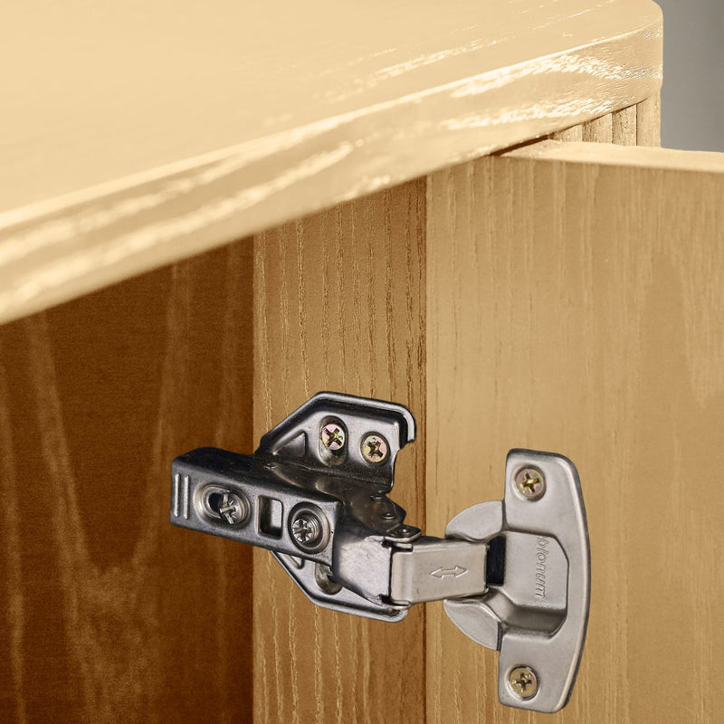 Close-up of a cabinet hinge on wooden doors