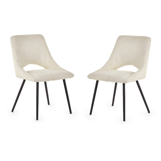 Two beige chairs with black legs on a white background