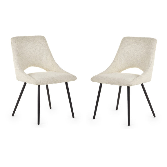 Two beige chairs with black legs on a white background