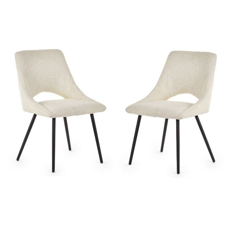 Two beige chairs with black legs on a white background