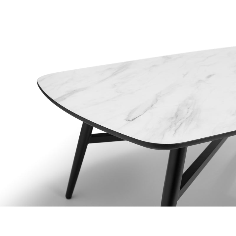 Marble coffee table with black legs on a white background