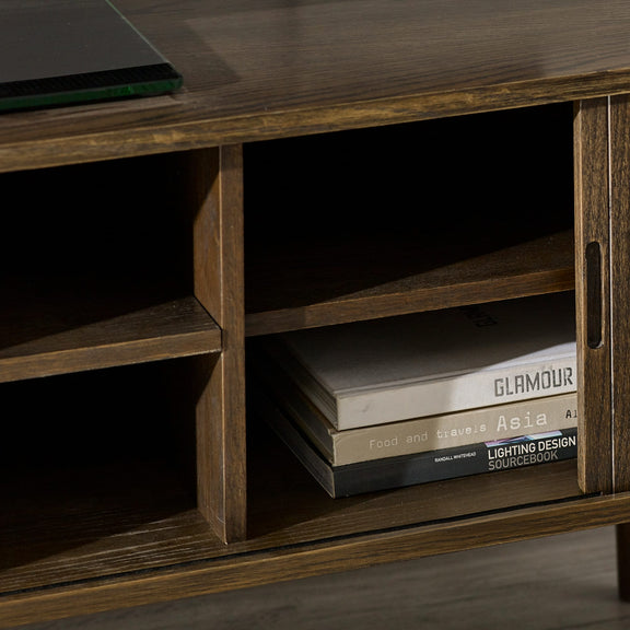 Wooden shelf with books on a dark background