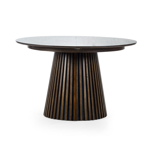 Round dining table with a textured cylindrical base on a white background