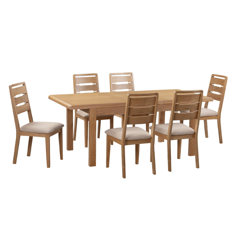 Wooden dining table with six matching chairs on a white background