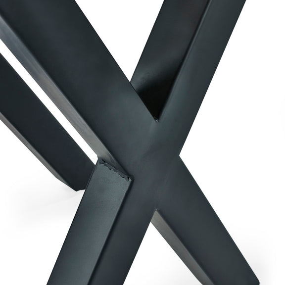 Close-up of a black metal crossbar on a white background