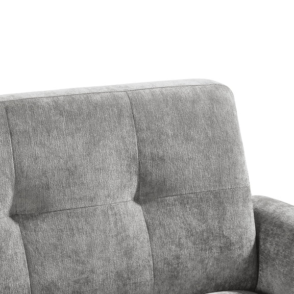 Gray upholstered chair with tufted backrest on a white background