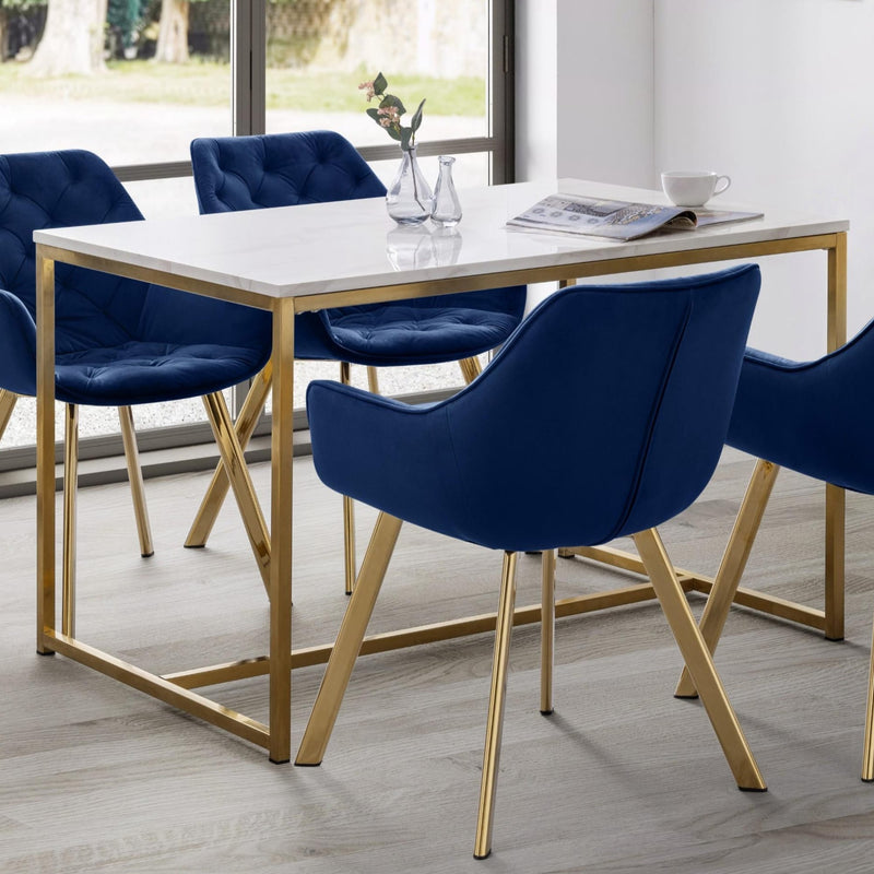 Dining table with blue chairs in a modern room