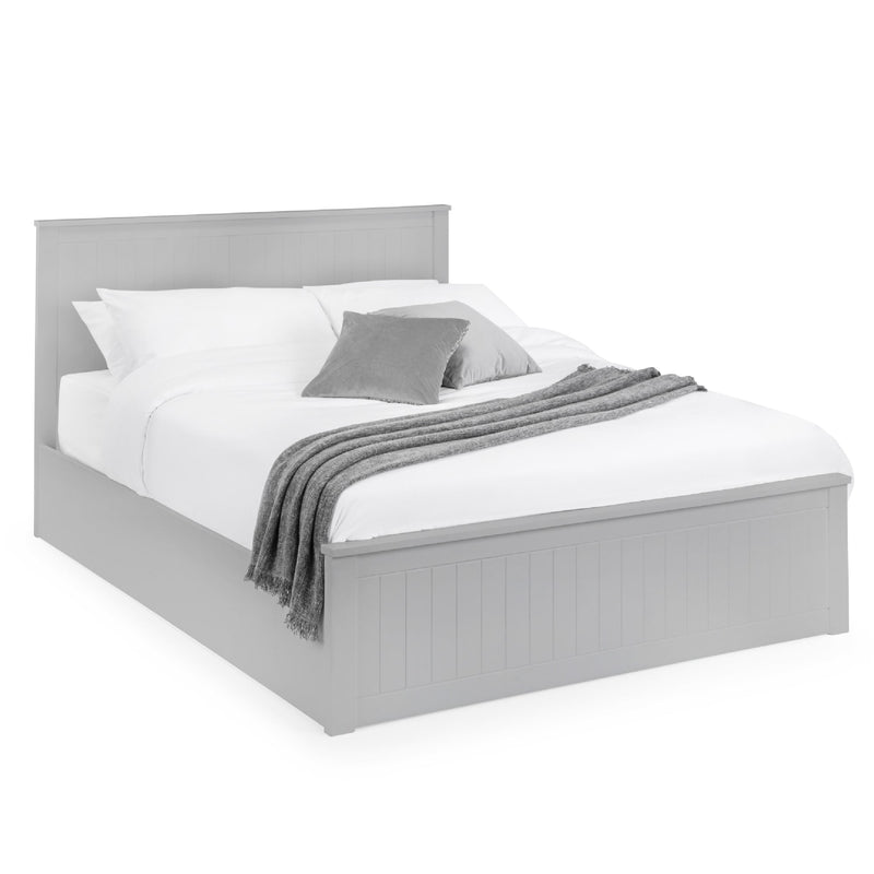 Gray bed frame with white bedding and gray blanket on a white background