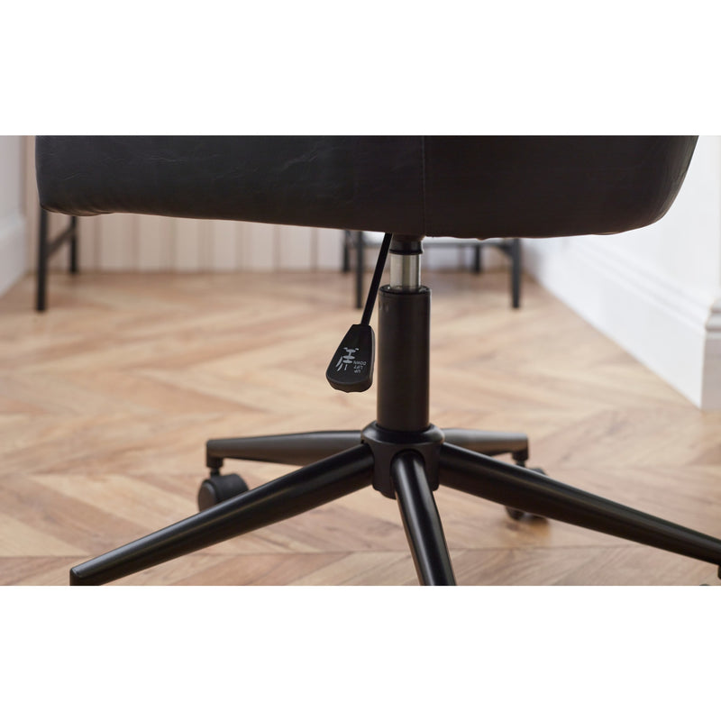 Black office chair with wheels on a wooden floor