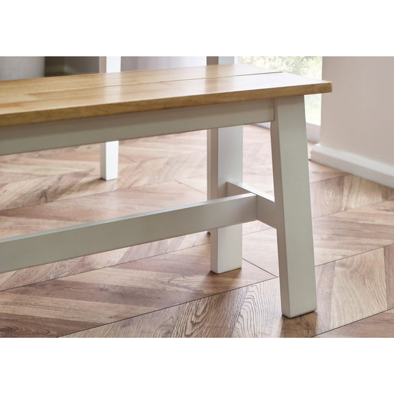 Wooden table with white legs on a wooden floor