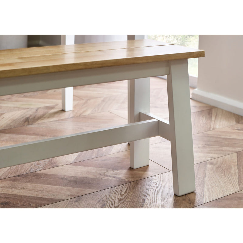 Wooden table with white legs on a wooden floor