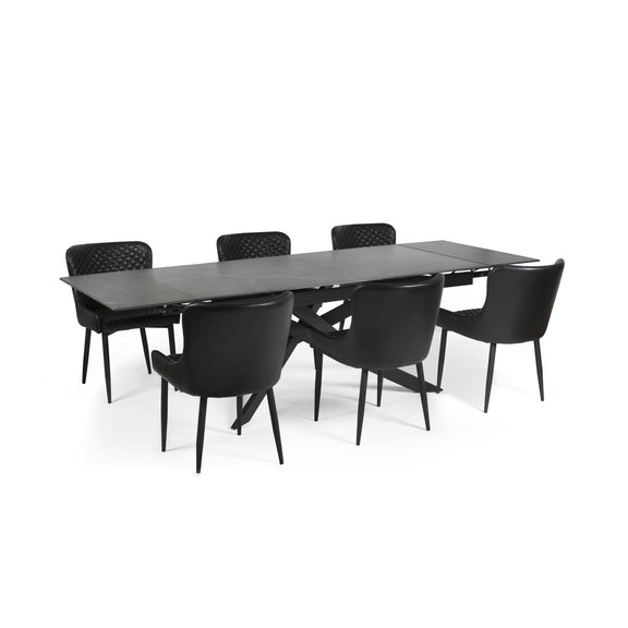 Black dining table with six chairs on a white background