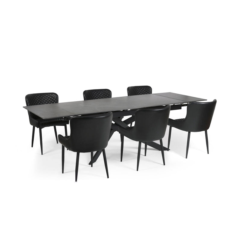 Black dining table with six chairs on a white background
