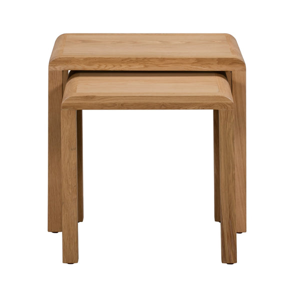 Two wooden nesting tables on a white background