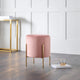 Pink stool with gold legs in a modern room setting