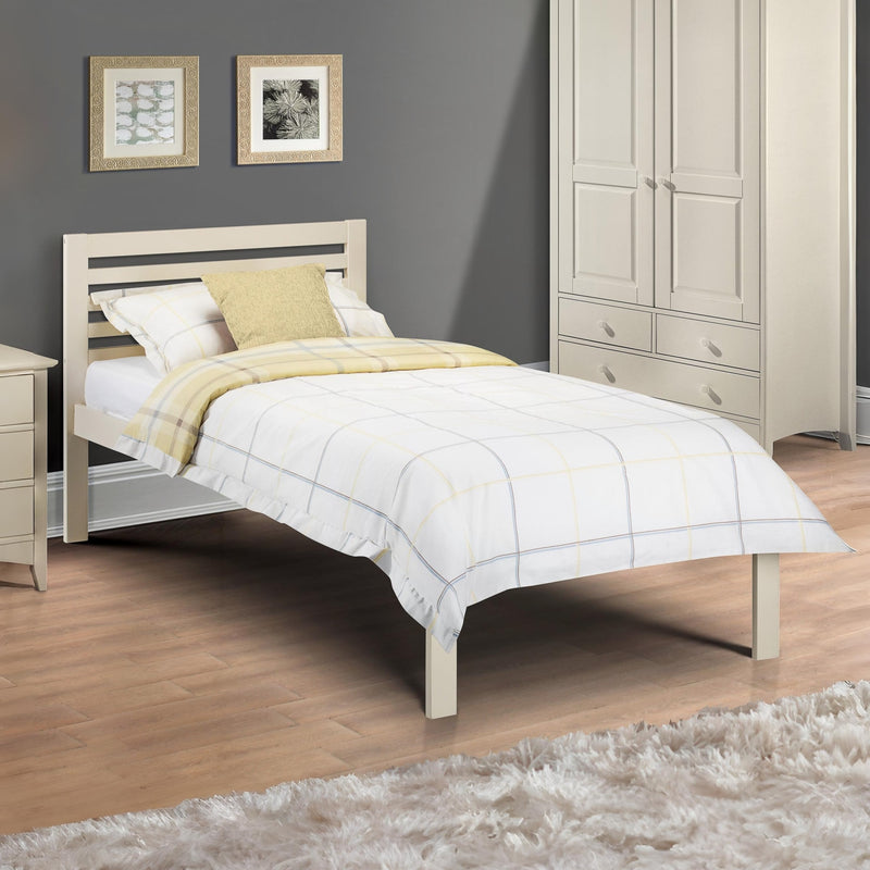 Bedroom with a wooden bed, nightstand, and wardrobe.