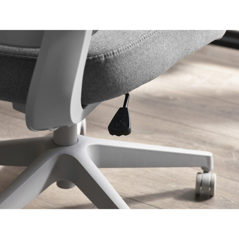 Close-up of a gray office chair with wheels on a wooden floor.