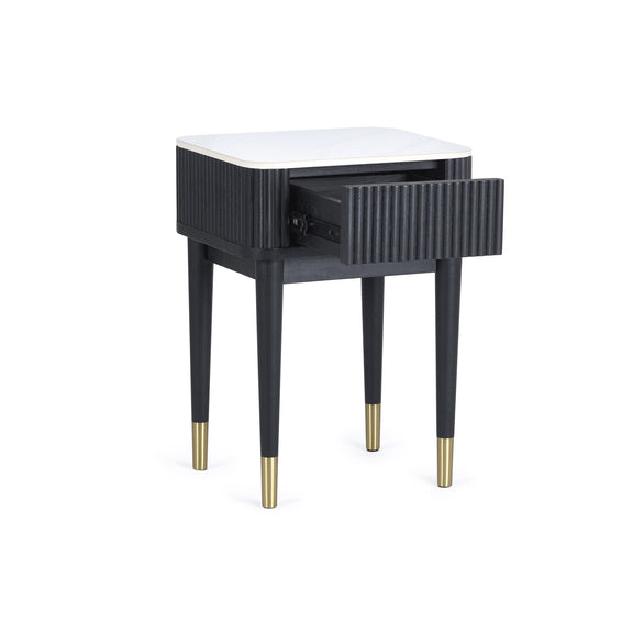 Black side table with a white top and gold legs on a white background