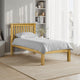 Wooden bed with gray bedding in a bright bedroom