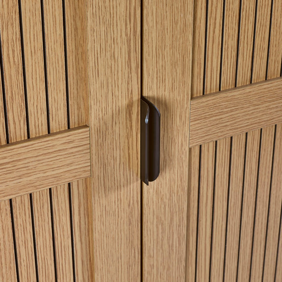 Close-up of a wooden cabinet with a black handle