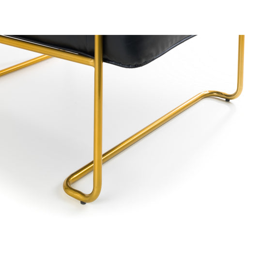 Close-up of a chair with gold metal legs on a white background