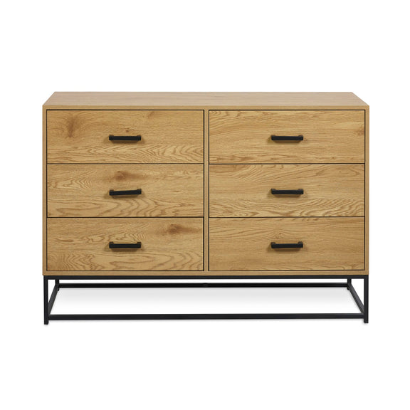 Wooden dresser with six drawers and black handles on a white background