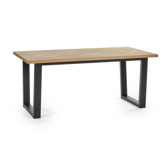 Wooden table with black metal legs on a white background