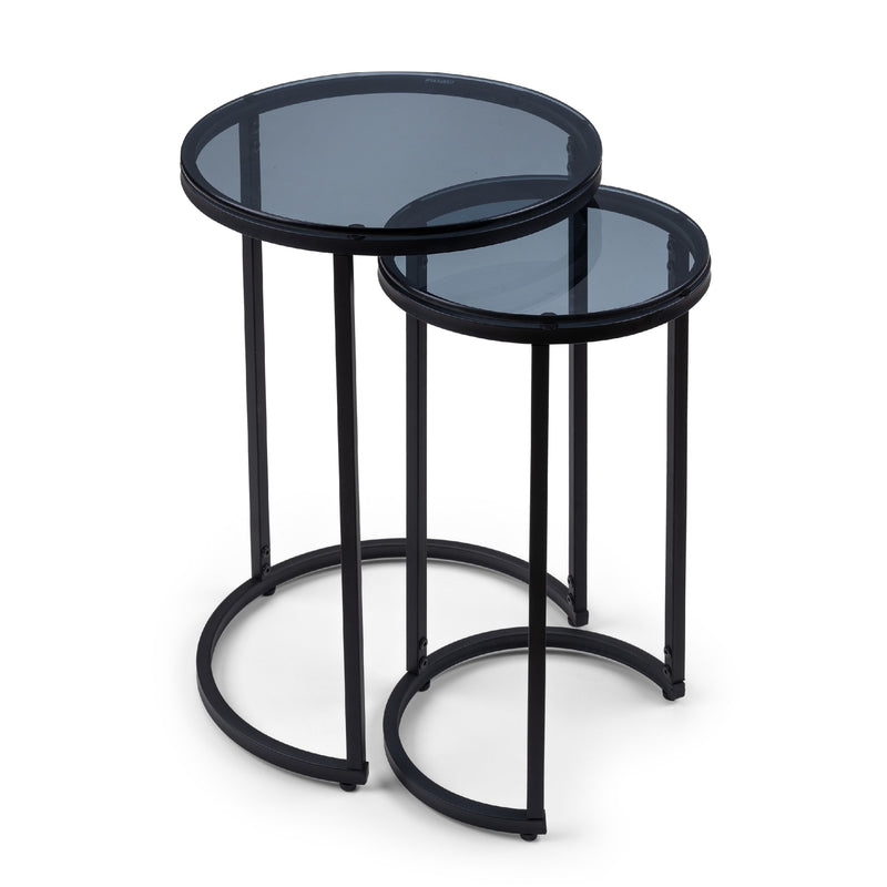 Set of two black metal nesting tables with glass tops on a white background