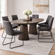 Dining room with a wooden table and gray chairs on a light rug.