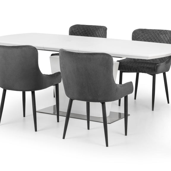 Dining table with four chairs on a white background