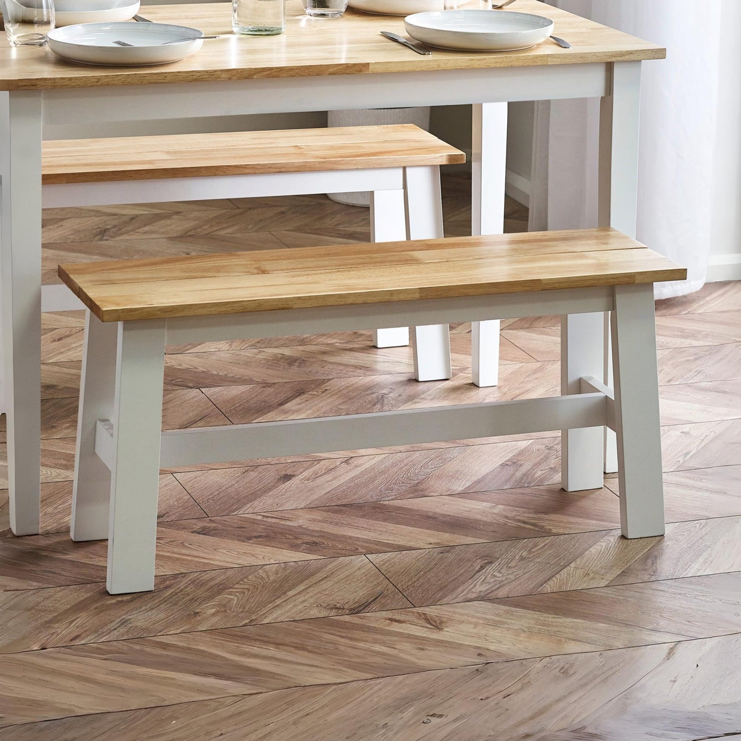 Wooden bench and dining table set on a wooden floor