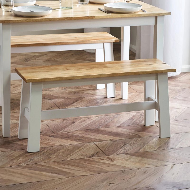 Wooden bench and dining table set on a wooden floor