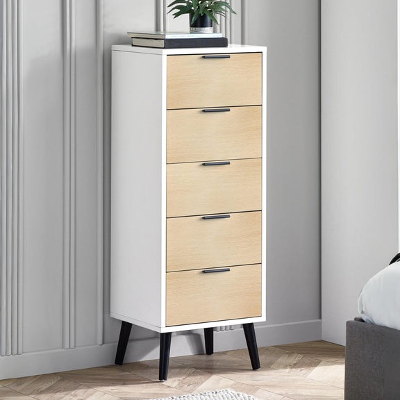 Tall white cabinet with wooden drawers against a gray wall.
