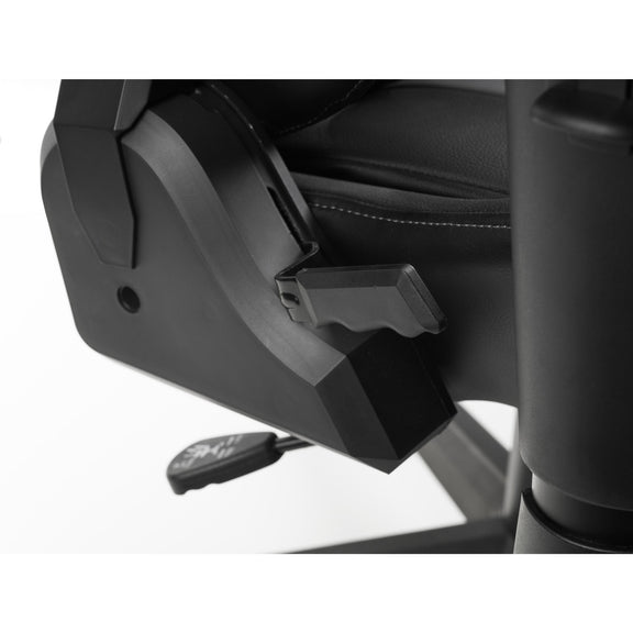 Close-up of a car seat with a black seat cover and armrest.