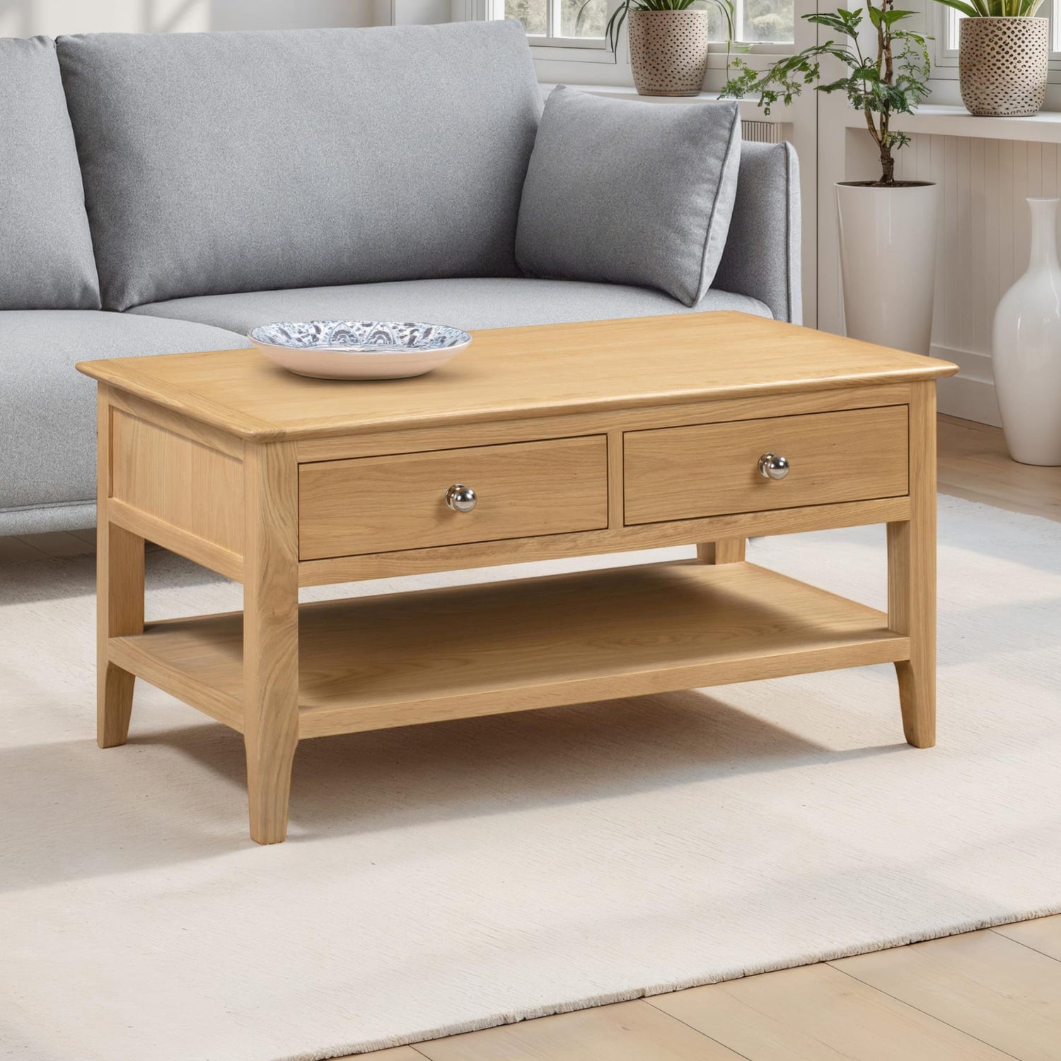 Wooden coffee table with two drawers in a living room setting.