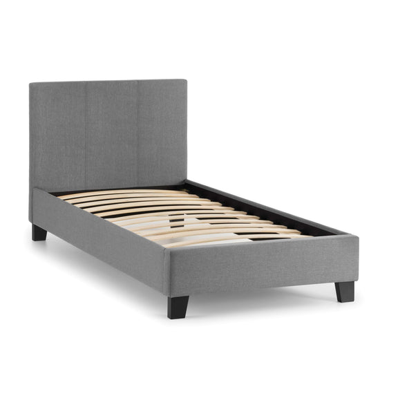 Gray upholstered bed frame with wooden slats on a white background