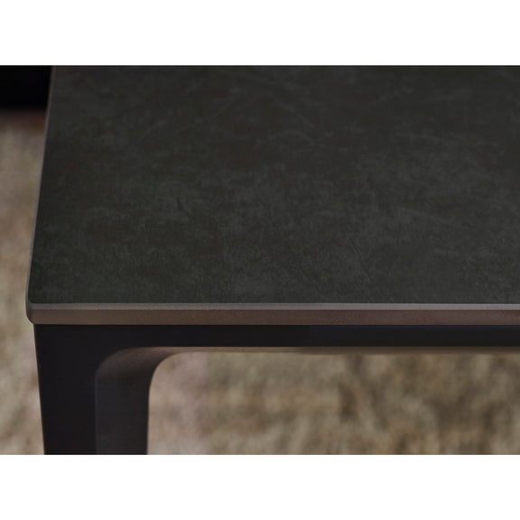 Dark stone countertop with a blurred background