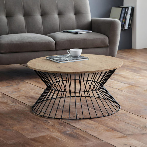 Wooden coffee table with black metal base in a living room setting